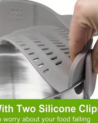 Adjustable silicone clip-on drainer for pots, pans, and bowls by Problems Solved, shown attached to cookware for drying.