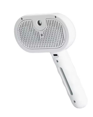 Dog steam comb pet massage brush by Problems Solved with USB charging, shown in use with a dog during grooming.