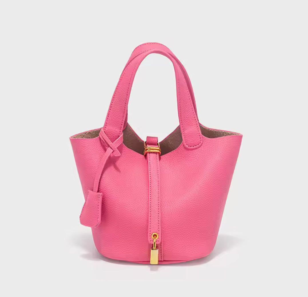 Classic Vegetable Women's Handbag by Problems Solved, simple bucket bag with smooth texture and spacious interior, displayed on a plain background.