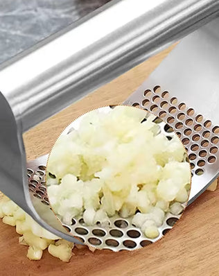 Problems Solved stainless steel garlic press squeezer, manual kitchen tool for easily crushing garlic cloves.