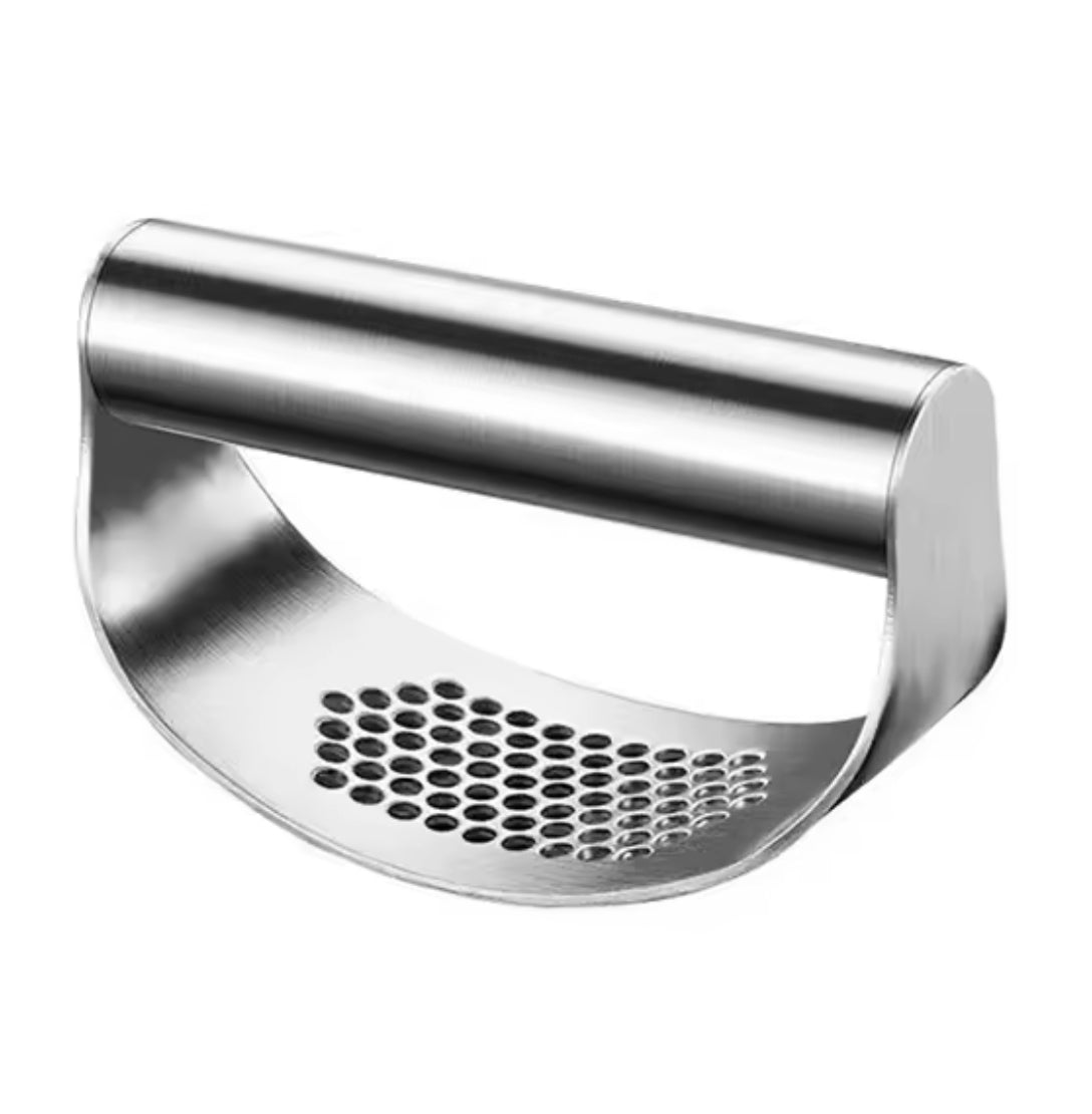 Problems Solved stainless steel garlic press squeezer showing a hand pressing garlic through the durable kitchen tool.