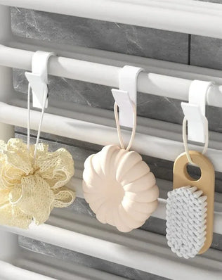 Problems Solved heated bathroom shower towel holder radiator rail with sleek design, mounted on a tiled wall.