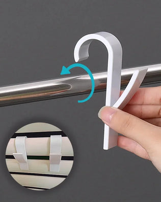 Bathroom towel holder hanger and heated radiator rail from Problems Solved, shown mounted on the wall with towels hanging.